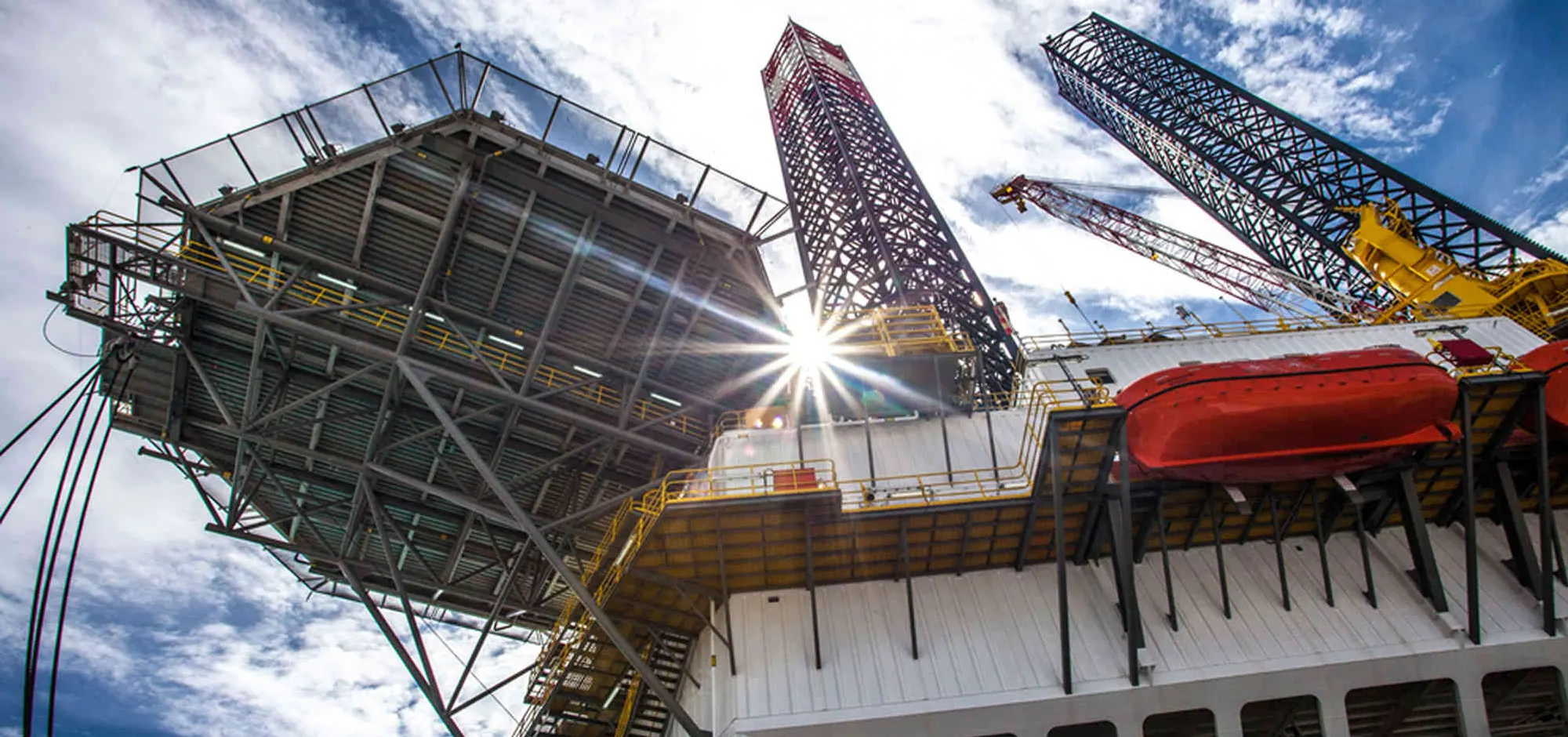 An oil platform against a bright sky